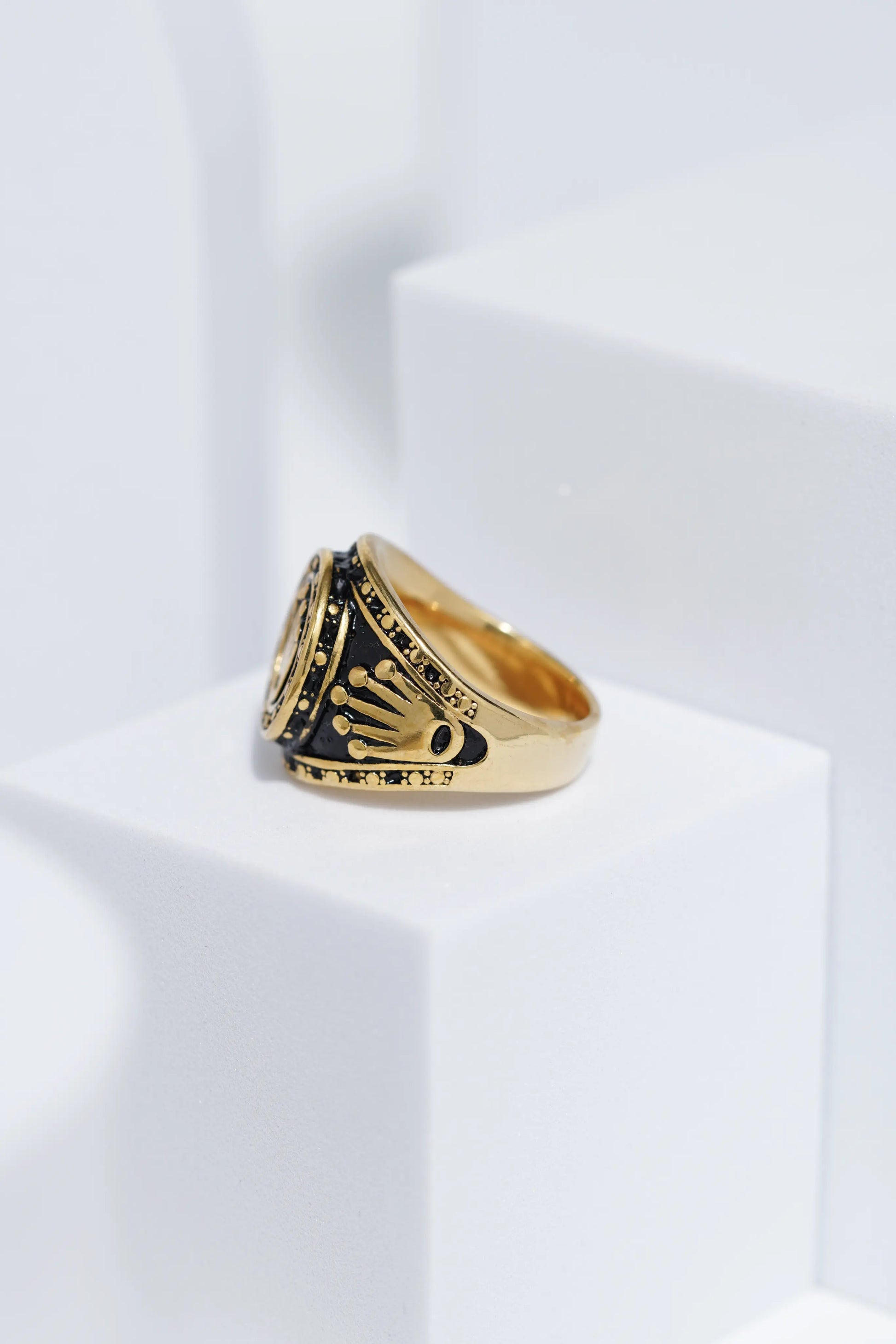 Crown Embossed Black Polish In Golden Color Stainless Steel Ring For Men. worldjewel.in men's ring